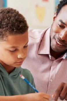 male teacher and student with pencil