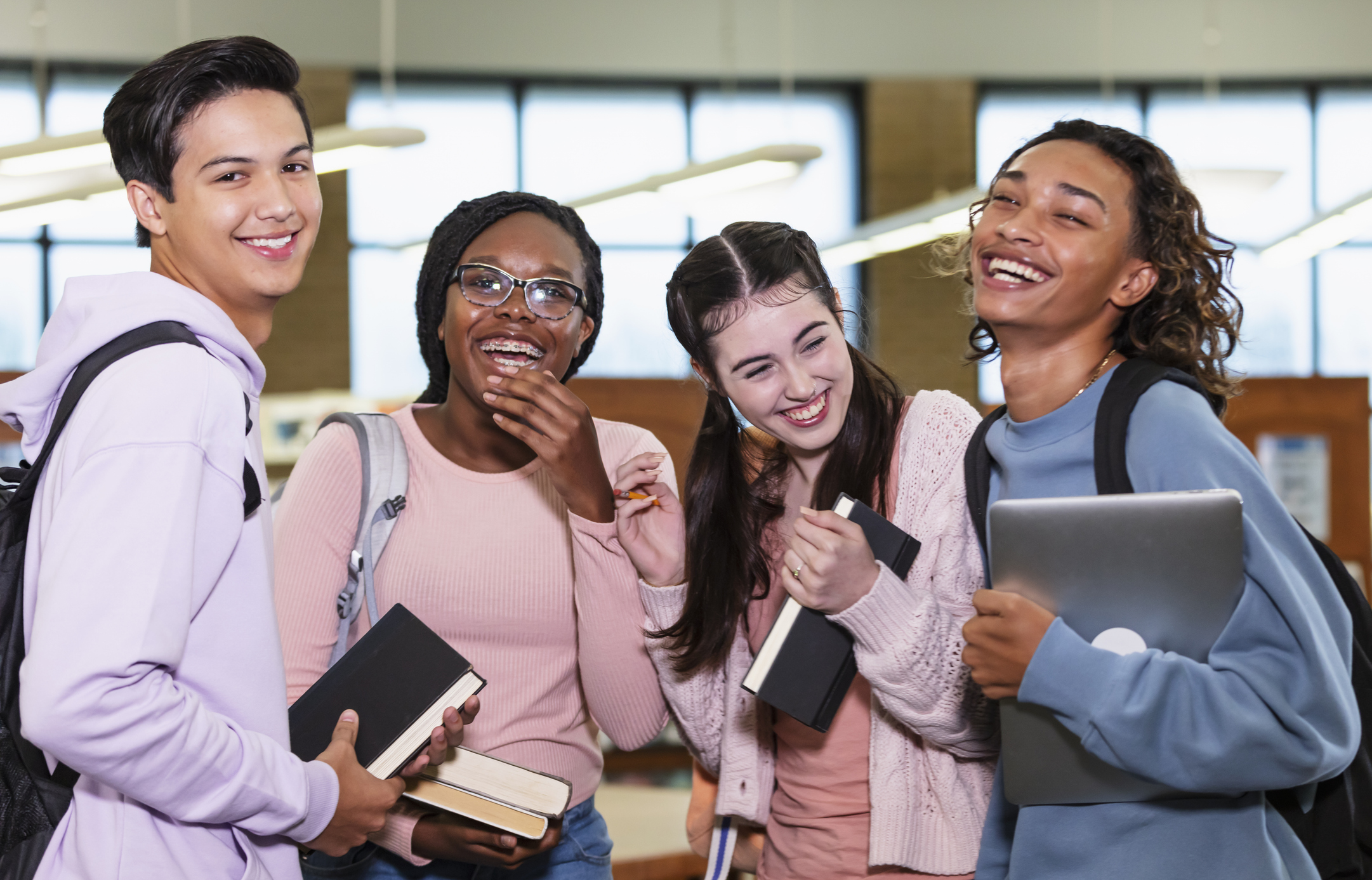 teen students laughing at school