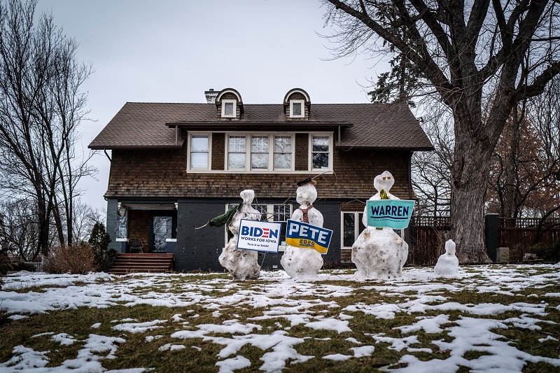 Student Voice makes a difference on the campaign trail. In this photo, Melting snowmen hold signs for three different presidential candidates on the front lawn of a home in Des Moines.